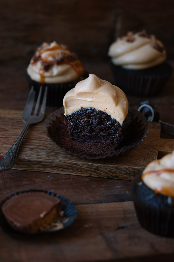 Moist chocolate cupcakes topped with a creamy peanut butter frosting | prettysimplesweet.com