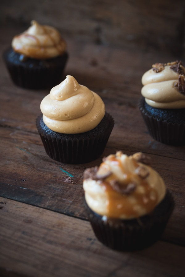 Moist chocolate cupcakes topped with a creamy peanut butter frosting | prettysimplesweet.com