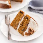 The ultimate layered carrot cake - incredibly moist, fluffy, and flavorful, and topped with the most amazing cream cheese frosting. | prettysimplesweet.com