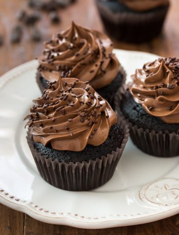 The ultimate chocolate cupcakes - perfectly moist and insanely chocolaty, topped with a supreme fudge chocolate frosting | prettysimplesweet.com