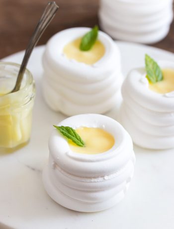 Soft and crunchy meringue nests that will melt in your mouth. Make them large or mini, and fill them with anything you want. | prettysimplesweet.com