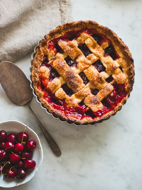 cherry pie with lattice top and fresh cherries