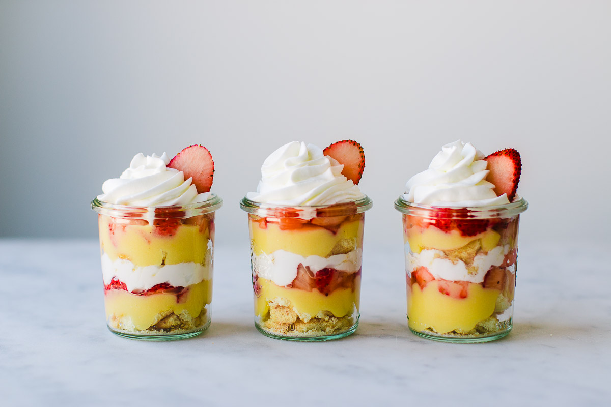 Delicious Lemon curd and fresh strawberries layered with vanilla cake and whipped cream to create three mini dessert parfaits.