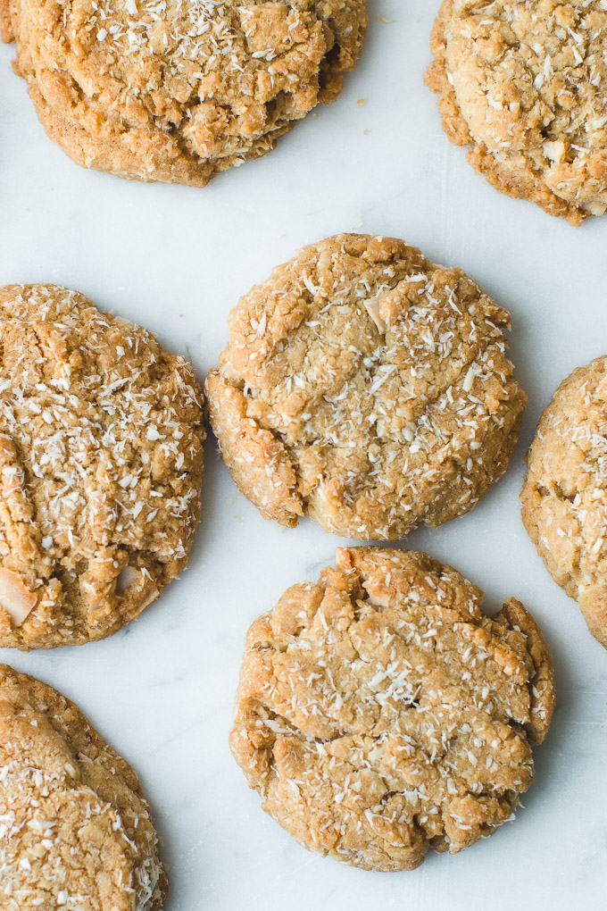 Perfectly round toasted Coconut Cookies with shredded coconut on top.