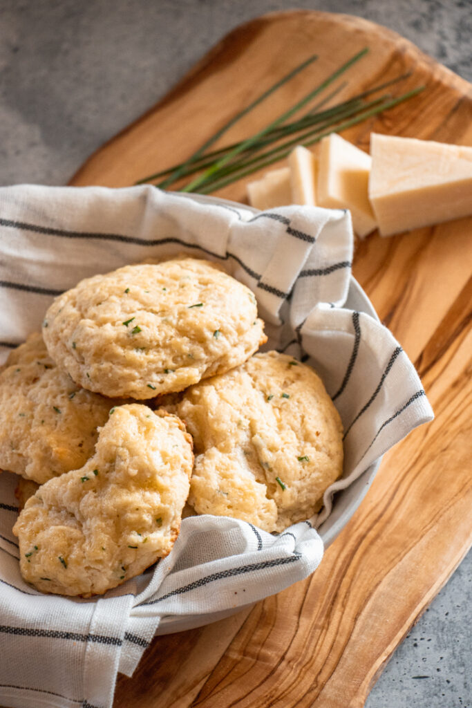 basket of white cheddar chive biscuits