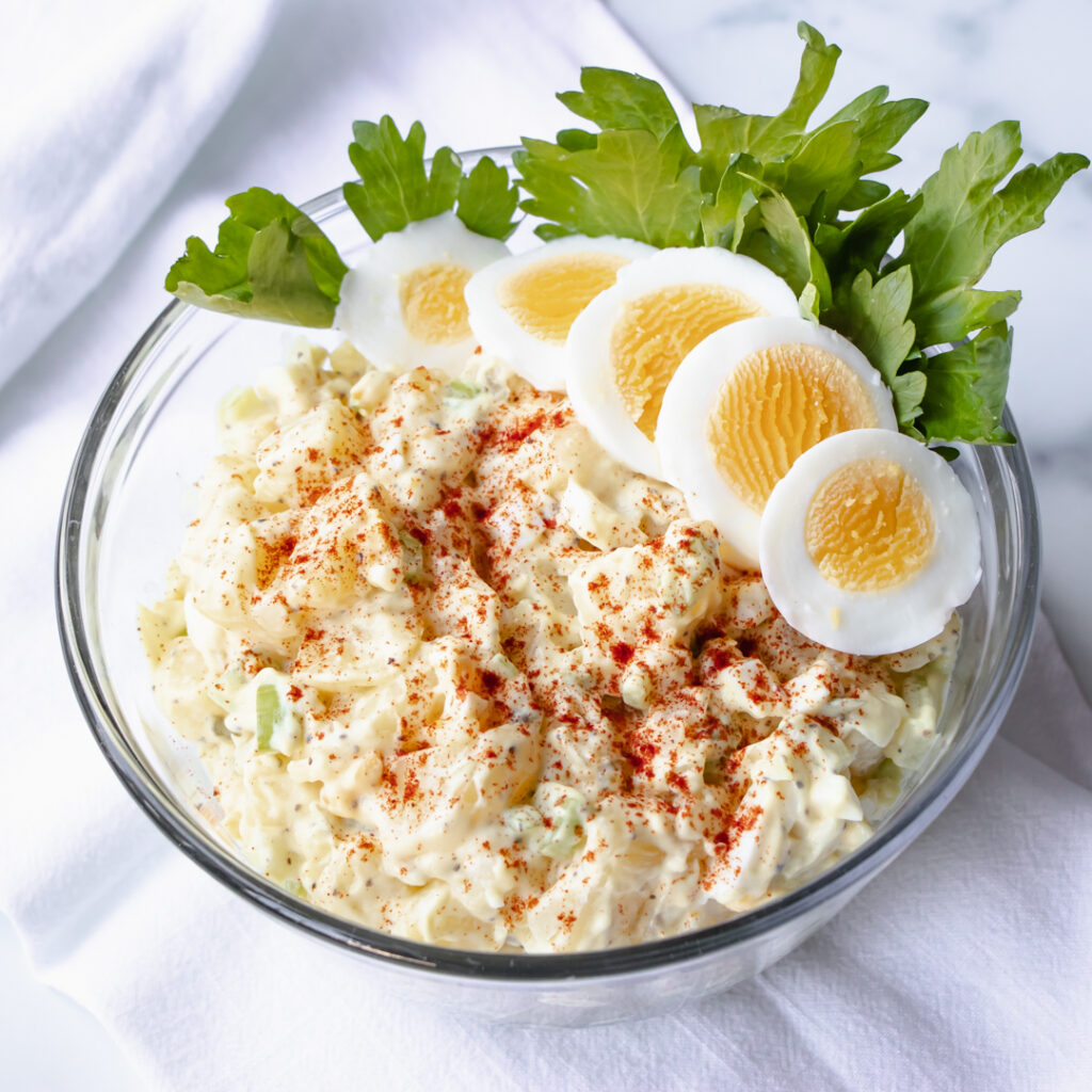 american potato salad with eggs celery onion and paprika