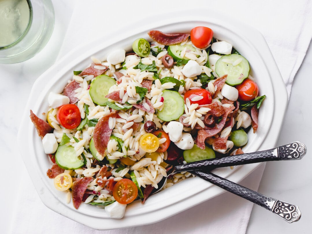 https://prettysimplesweet.com/wp-content/uploads/2023/07/Mediterranean-Pasta-Salad-01.jpg