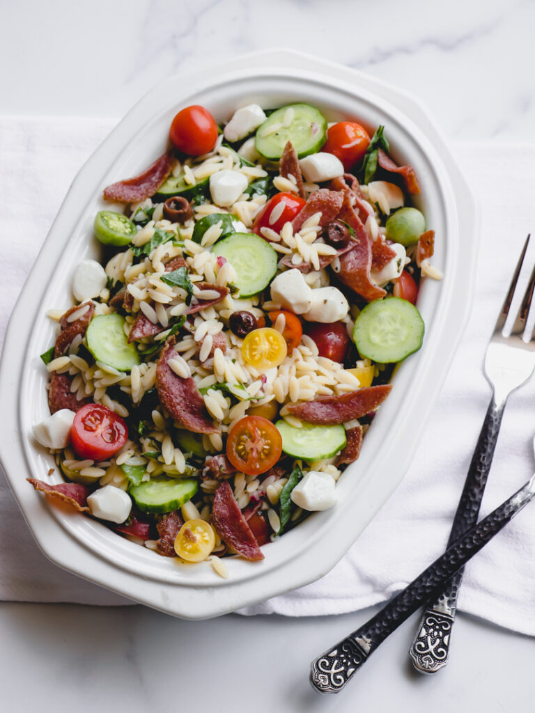 mediterranean pasta salad with tomatoes cucumbers mozzarella salami