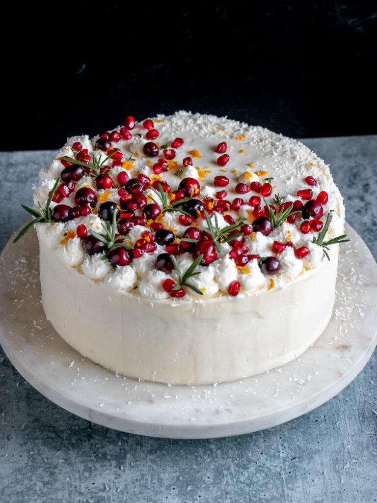 Orange layer cake with cranberry filling and cream cheese frosting