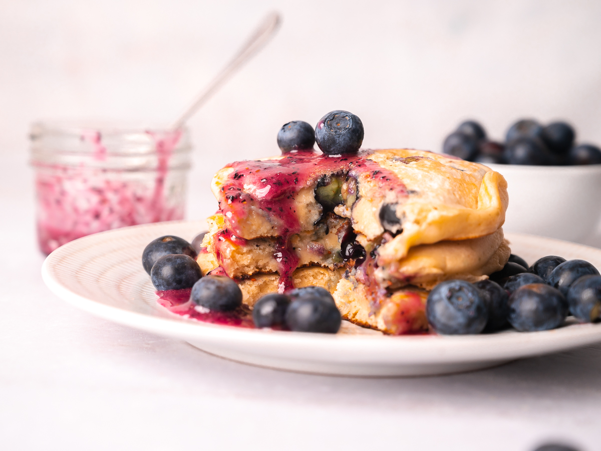 Triple blueberry pancakes have blueberries added twice to the batter and once to the fresh homemade blueberry syrup on top.
