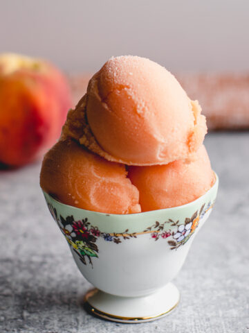 Homemade frozen peach sorbet made with real peaches.