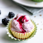 Mini blackberry key lime pies with blackberry whipped cream frosting.