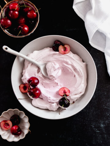 Creamy cherry frosting made with whipped cream, mascarpone cheese, and fresh cherries.