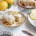 Lemon poppy seed scones with a lemon icing glaze drizzled on top.