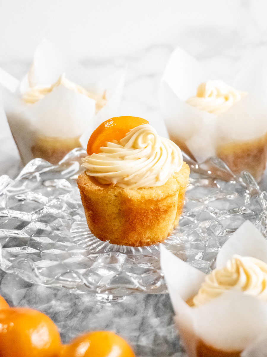 Citrusy orange cupcakes with a swirl of orange cream cheese frosting made with fresh orange juice and zest.