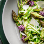 Shaved wild asparagus salad with chive blossoms.