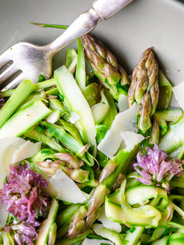 Shaved asparagus salad with chive blossom vinaigrette dressing.