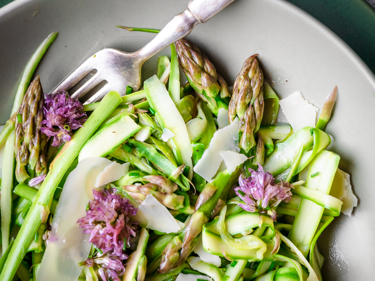 Shaved asparagus salad with chive blossom vinaigrette dressing.