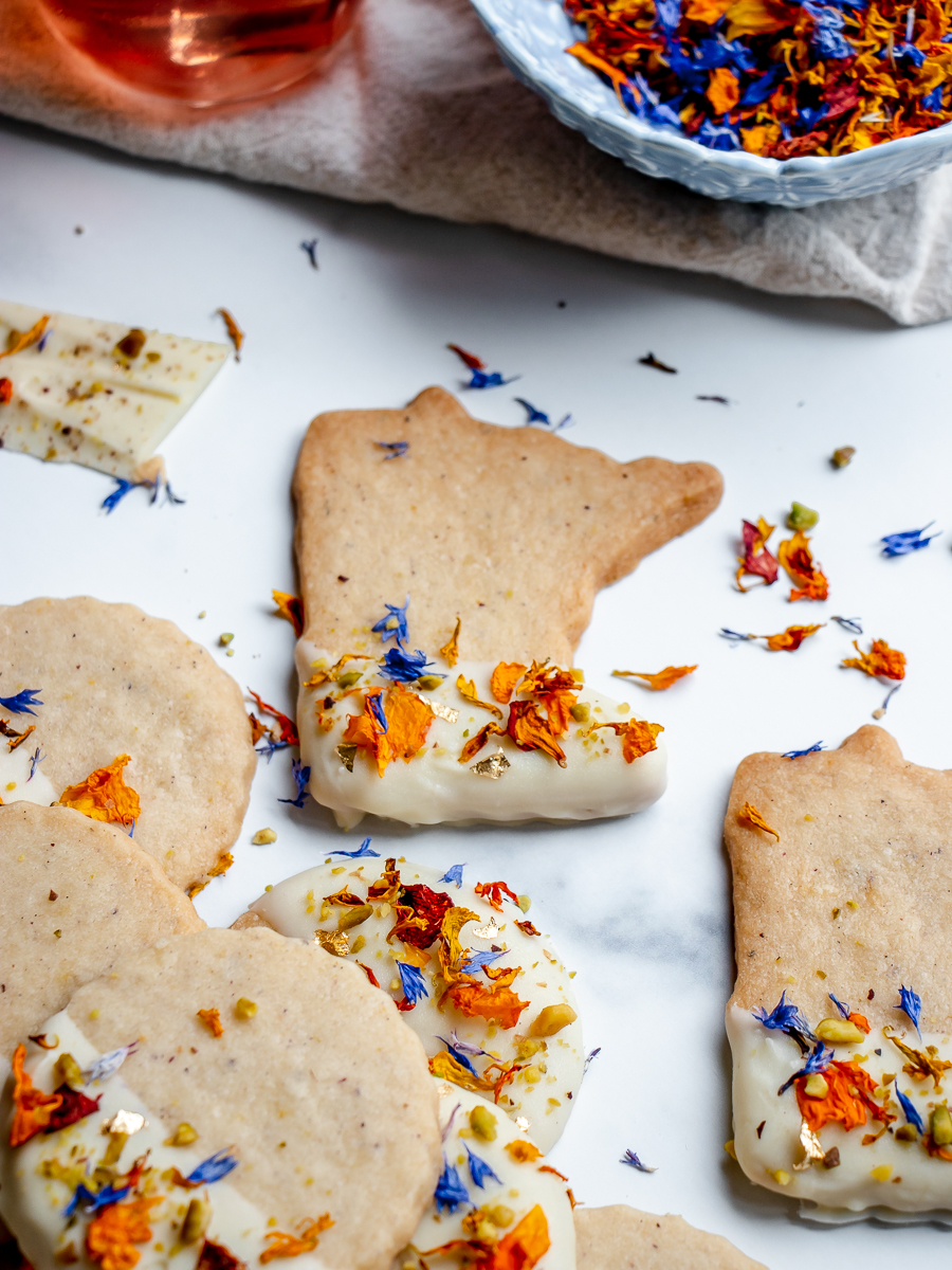minnesota love cookie decorated with orange and blue flower sprinkles.